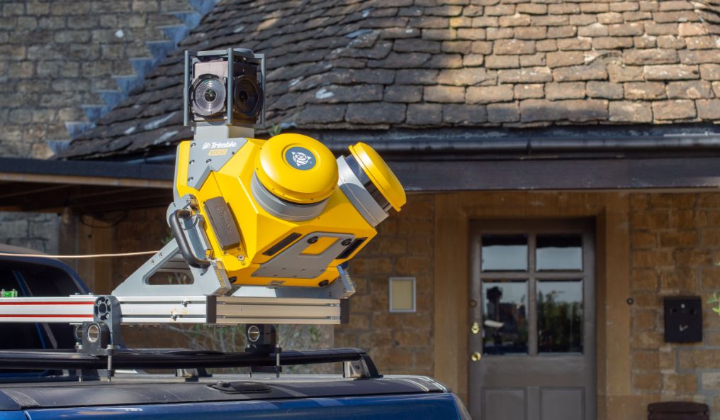Image shows a roof mounted survey camera on a car

